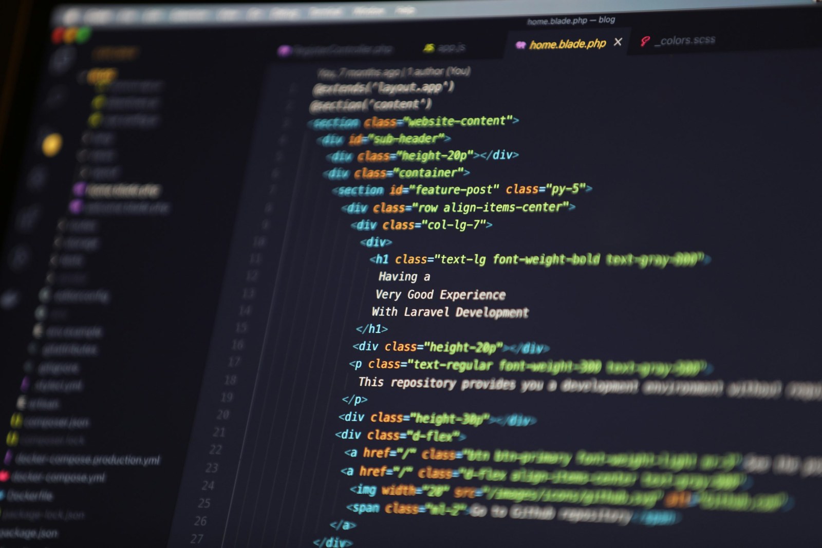 A blurred code editor window showing HTML markup for a webpage layout.